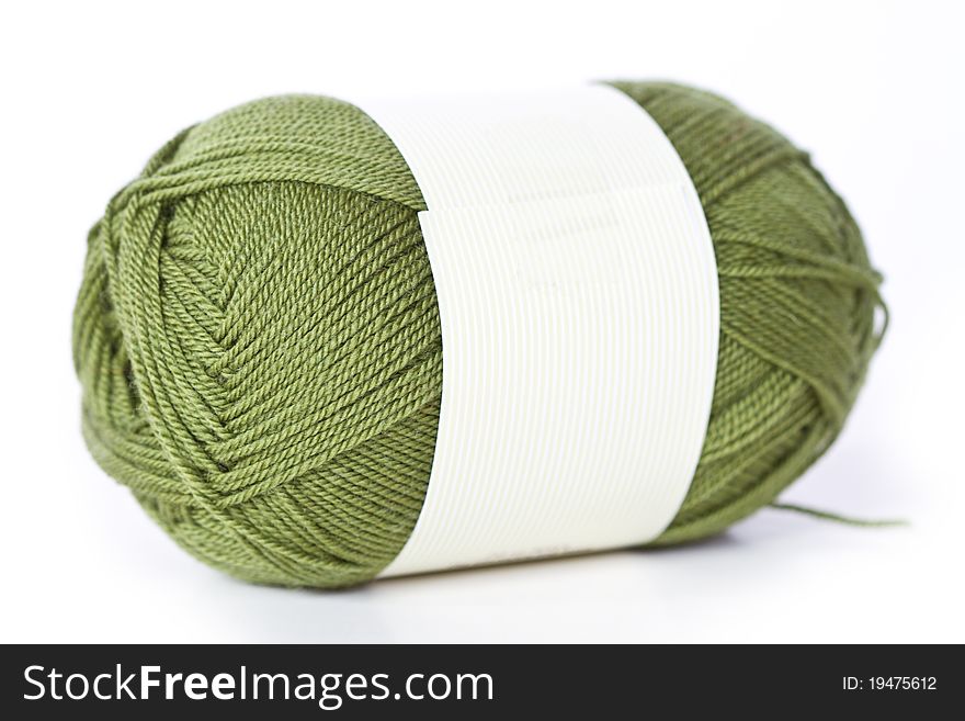 Green woolen a thread whith white background. Green woolen a thread whith white background