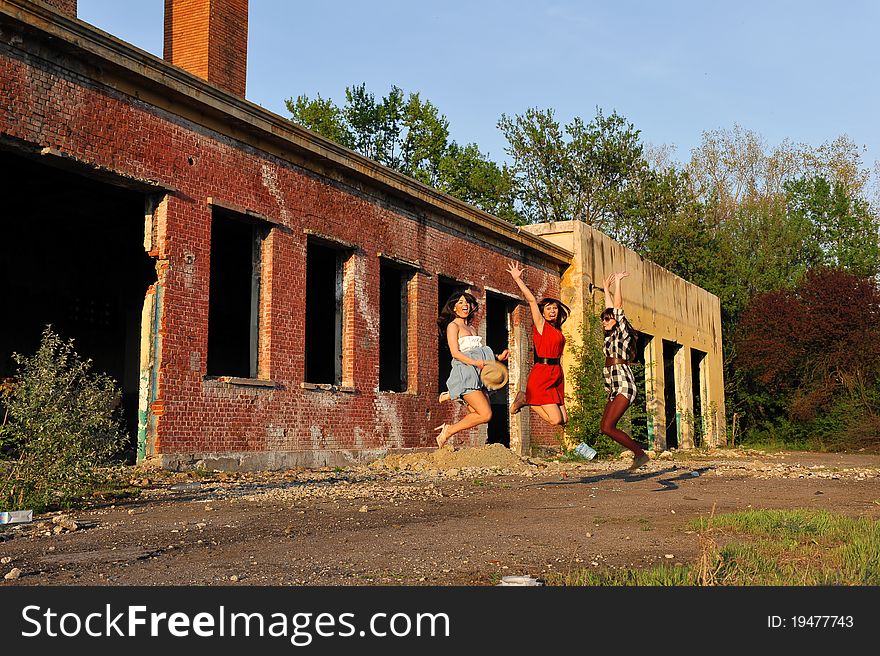 Portrait with three young woman jumping. Portrait with three young woman jumping