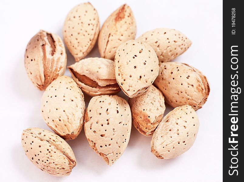 Handful of almonds isolated on white background. Handful of almonds isolated on white background