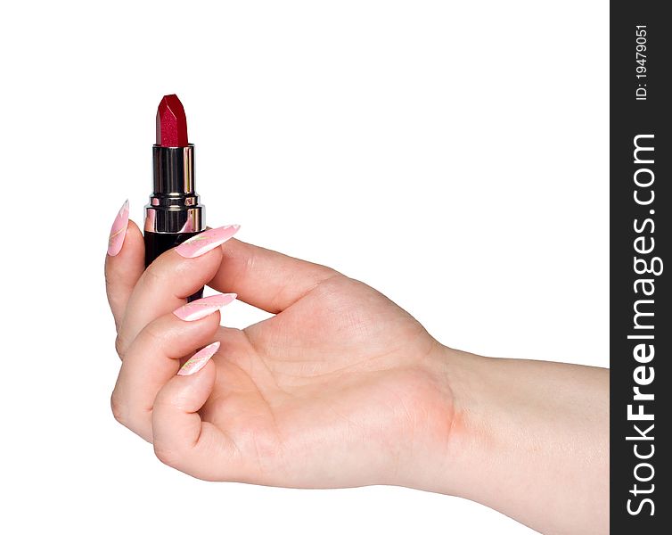 In the photo represented a hand holding a lipstick. In the photo represented a hand holding a lipstick
