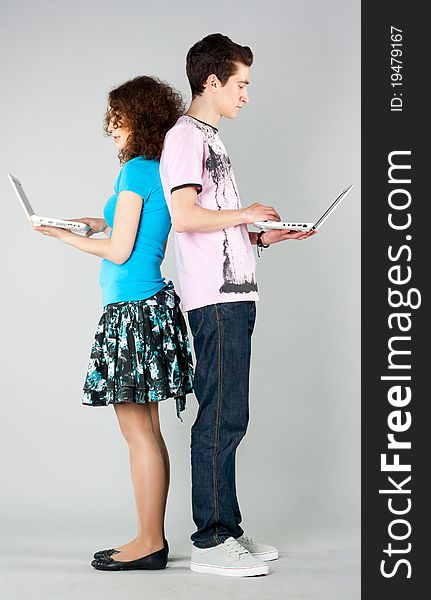 Boy and girl stand with notebooks in hands. Boy and girl stand with notebooks in hands