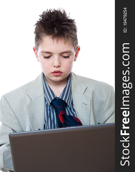 Portrait of a boy with a computer isolated on white. Portrait of a boy with a computer isolated on white