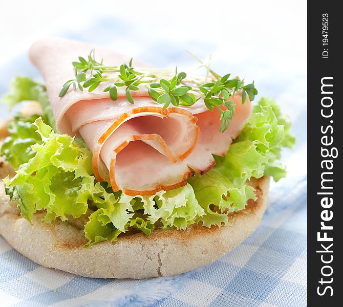 Fresh english muffin with ham and salad. Fresh english muffin with ham and salad