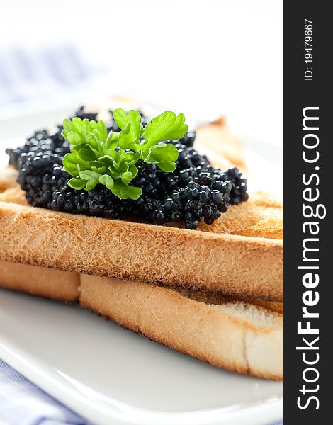 Black caviar on toast closeup