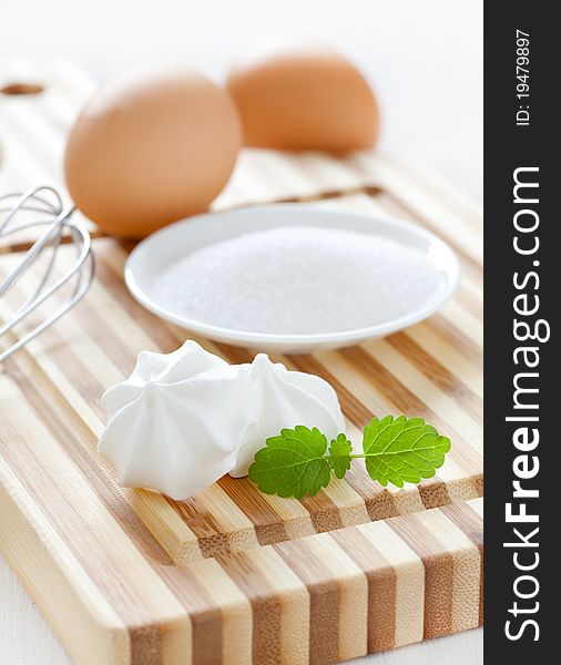 Ingredients for meringue cookies on cutting board. Ingredients for meringue cookies on cutting board