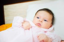Beautiful Baby Girl Is Lying In A Bed. Stock Photography Beautiful Baby Girl Is Lying In A Bed. Stock Photography