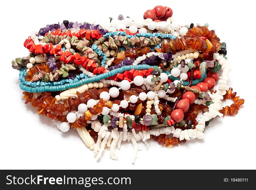 Many necklaces over a white background