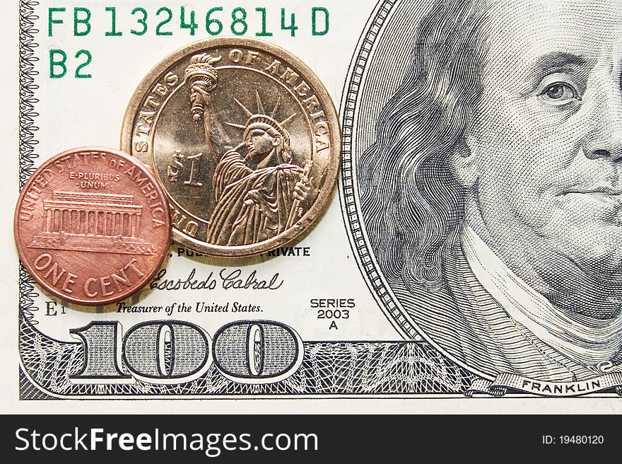 One Cent And Dollar Coins On One Hundred Bill