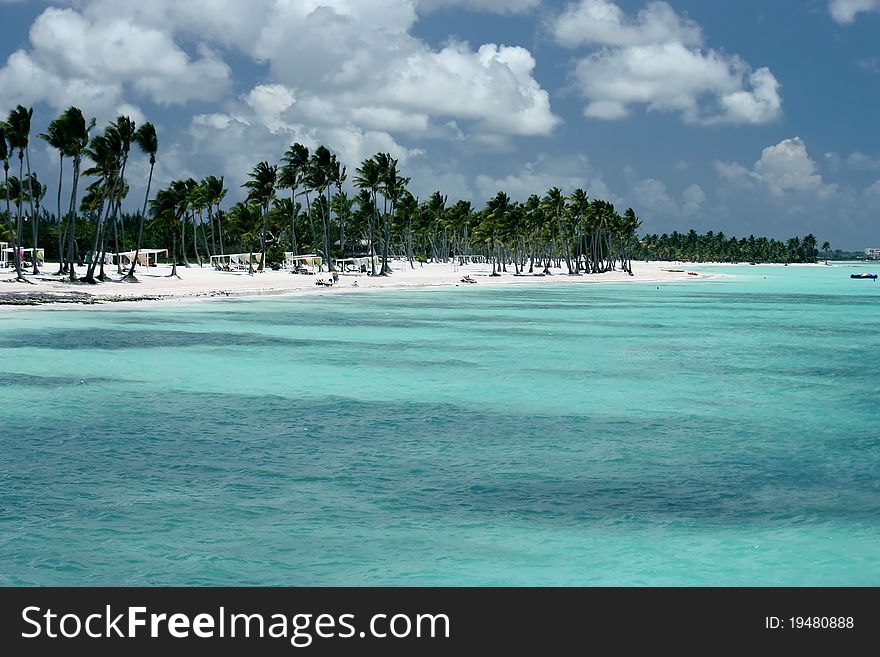 Turquoise ocean, white sand beach and palm trees. Turquoise ocean, white sand beach and palm trees