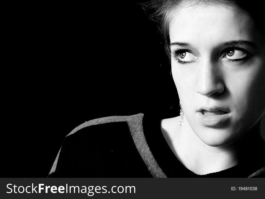 Face of very amazed girl, on black background. Face of very amazed girl, on black background