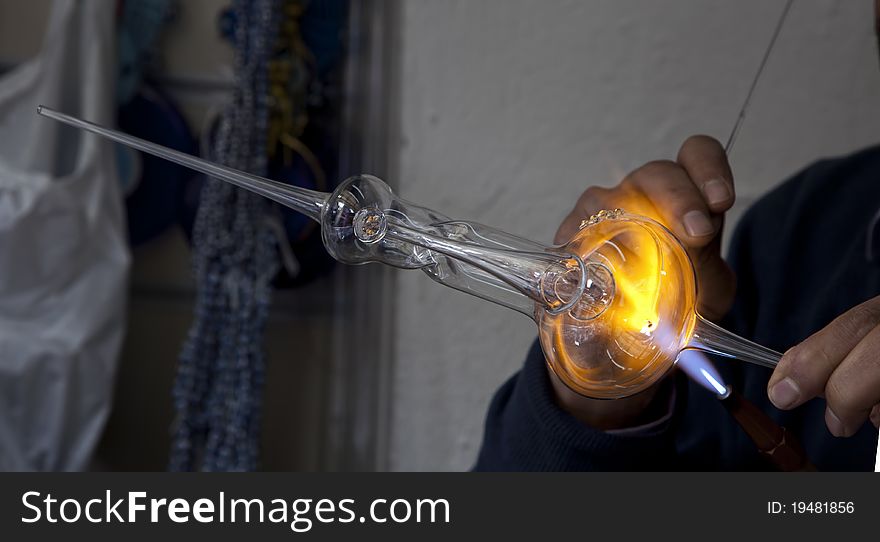 Glass artist making lamb with glass