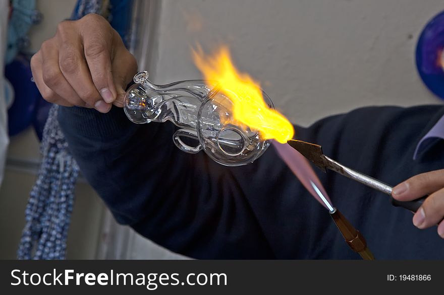 Glass artist making lamb with glass