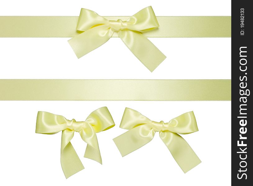 Yellow multiple  ribbons with bow isolated on white. Yellow multiple  ribbons with bow isolated on white