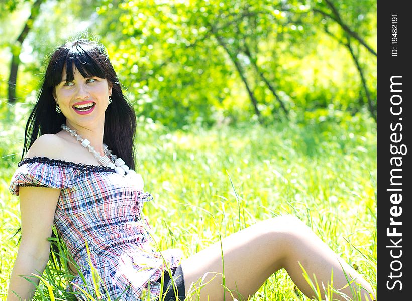 Single beautiful woman relaxing at the park. Single beautiful woman relaxing at the park