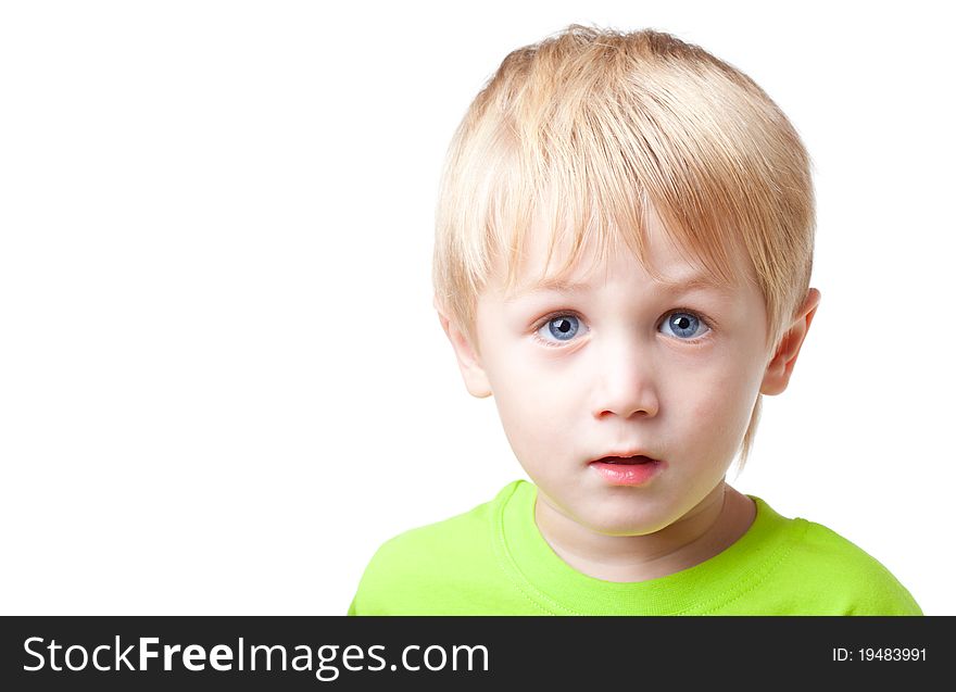 Boy of five years is focused and tense, close up, white background. Boy of five years is focused and tense, close up, white background