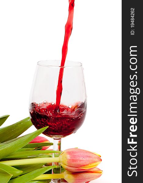 Red wine pouring into wine glass background