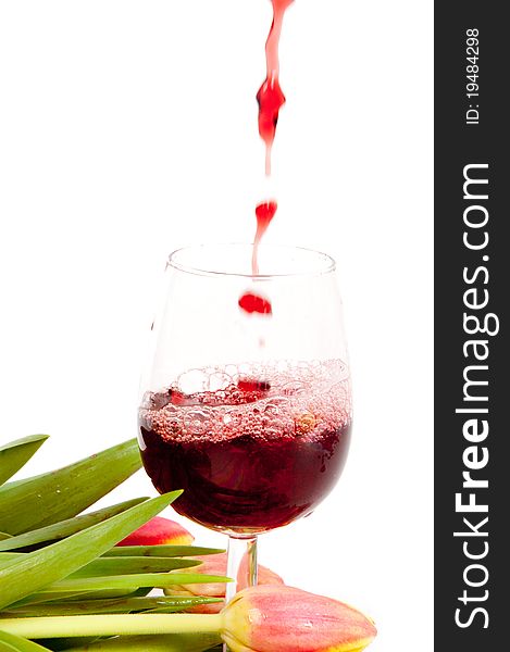 Red wine pouring into wine glass background