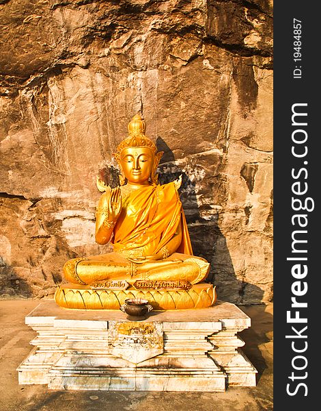 Peaceful golden Buddha in the mountain. Peaceful golden Buddha in the mountain