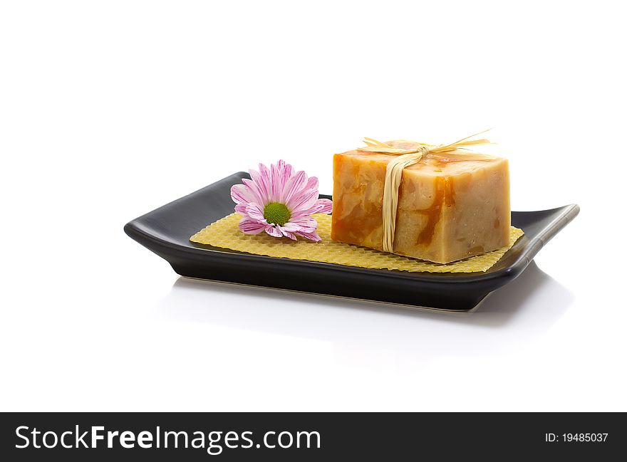 Natural handmade soap and pink flower, on a white background. Natural handmade soap and pink flower, on a white background.