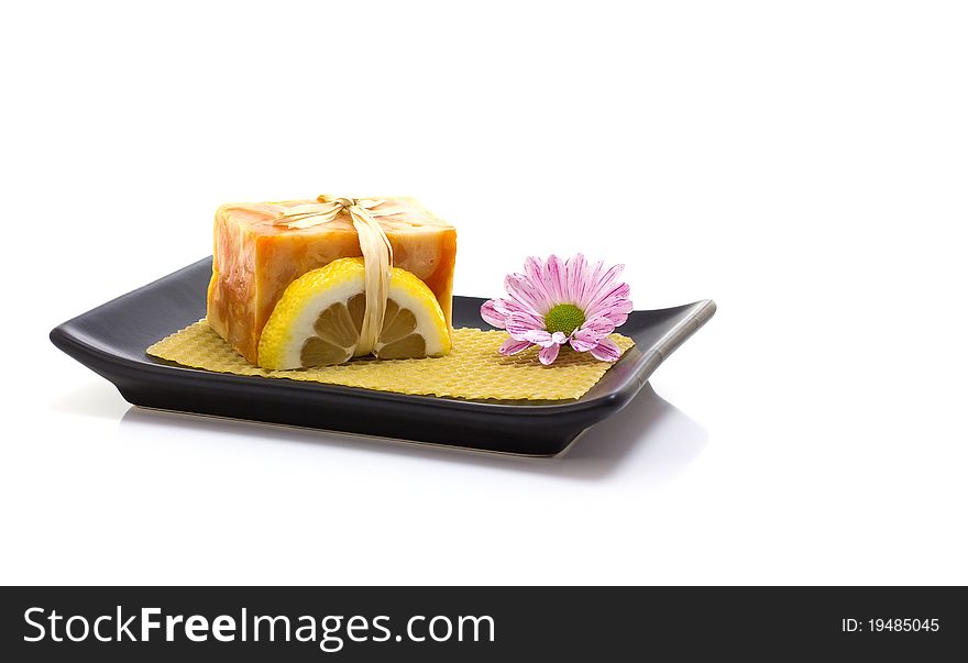 Natural handmade soap and pink flower, on a white background. Natural handmade soap and pink flower, on a white background.