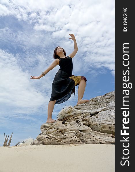 Young Woman Performs On Beach