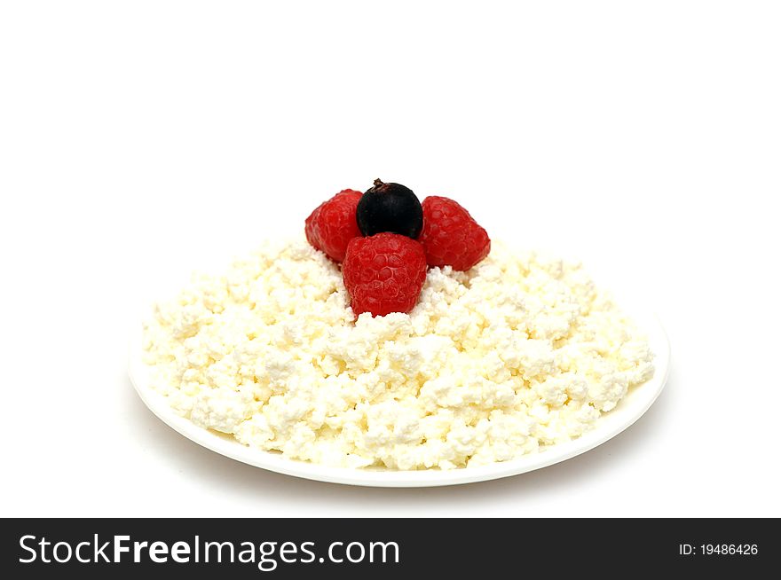 Cottage cheese with berries red ripe strawberries on the plate with isolated on a white background