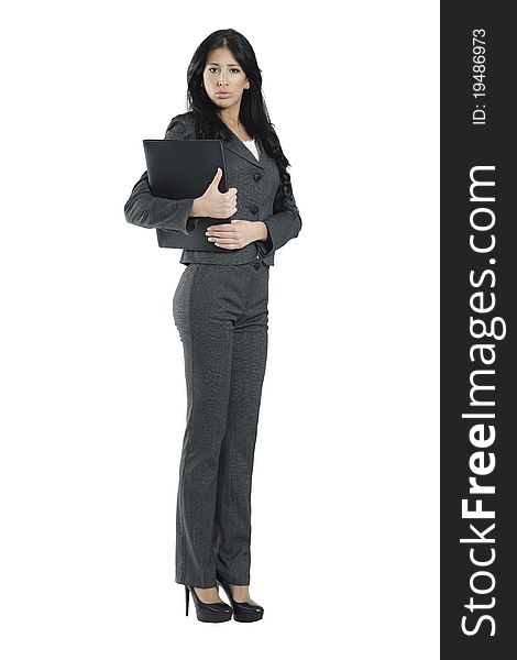 Young businesswoman wearing trouser suit standing against white background holding black business portfolio. Young businesswoman wearing trouser suit standing against white background holding black business portfolio