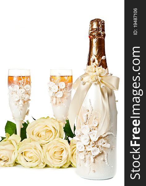 Two glasses of celebratory champagne with white roses. Two glasses of celebratory champagne with white roses