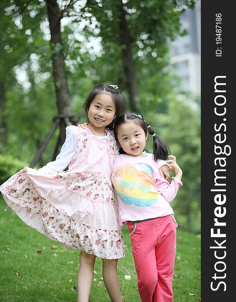 Sisters playing on the grass, shot in 2011, locations in china