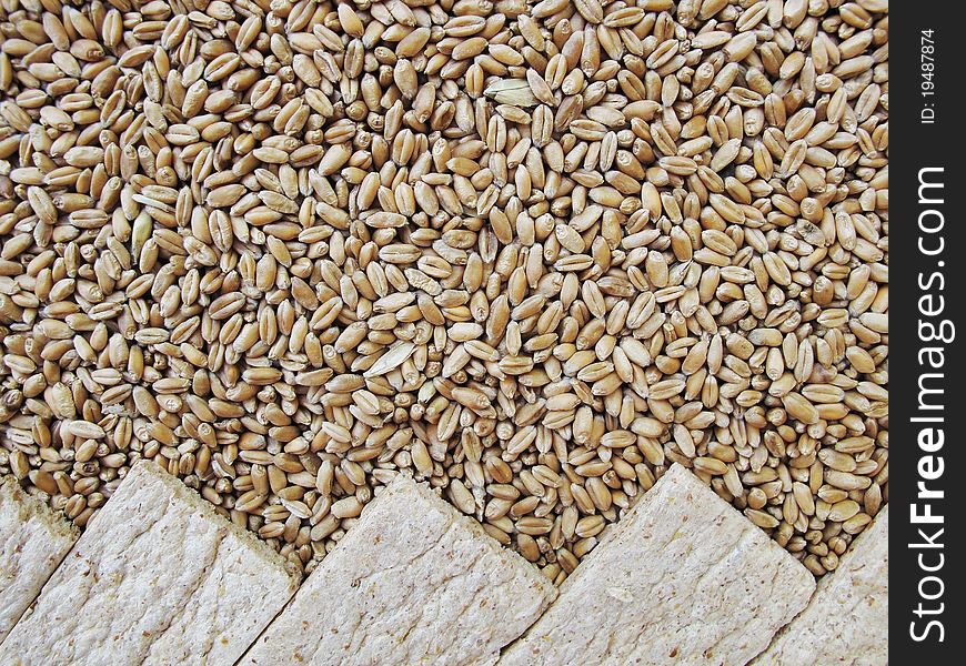 Small loaf (of bread), bread crisps and grains of wheat