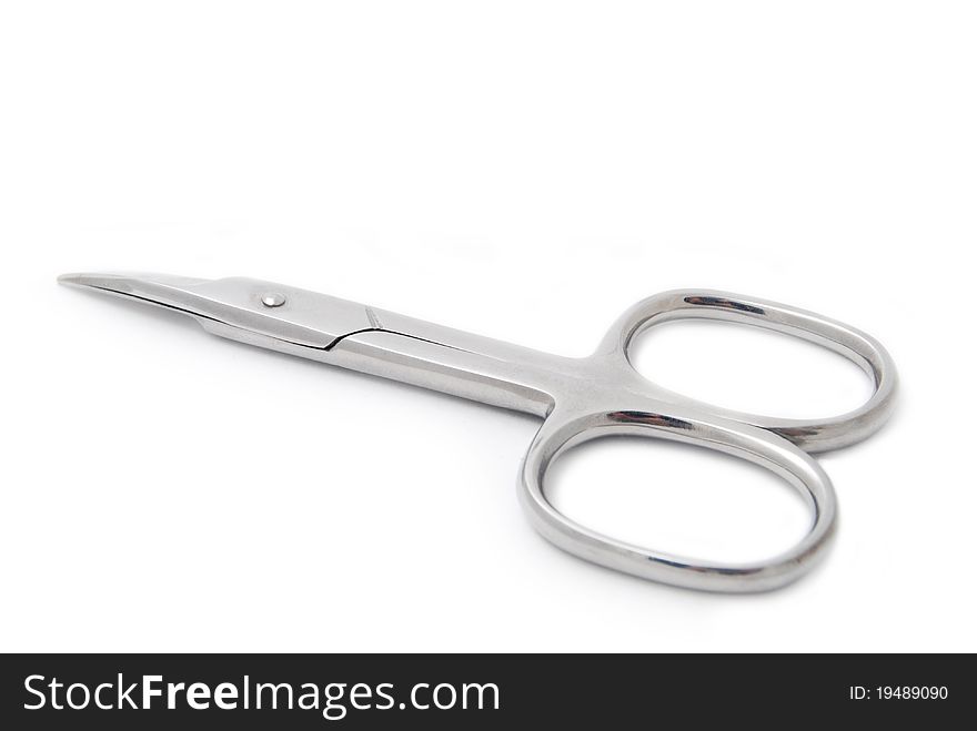Steel manicure scissors isolated on white background close-up