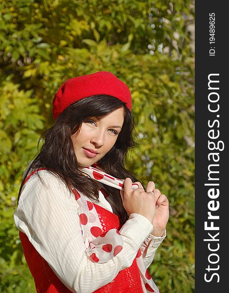 Nice girl in red beret looking at camera