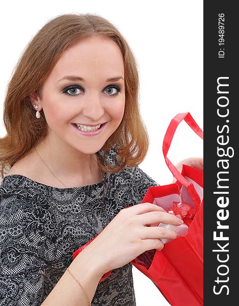 Portrait of young woman with shopping bags over white background