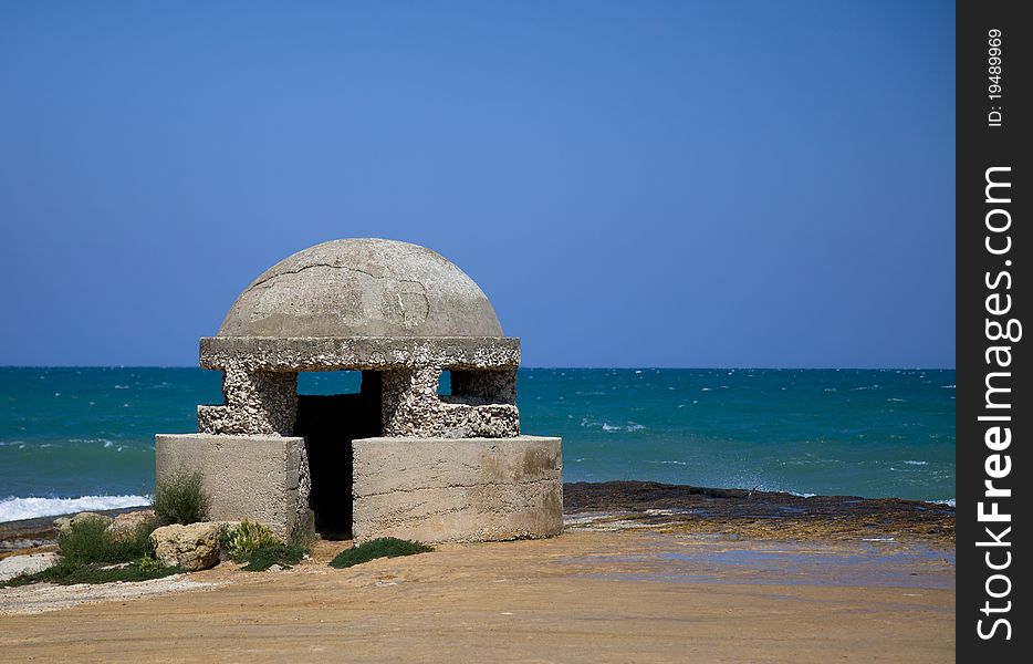 Bunker on the beach with blue sky