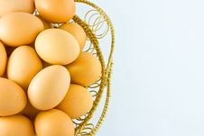 Chicken Eggs In A Basket On White Background Royalty Free Stock Image