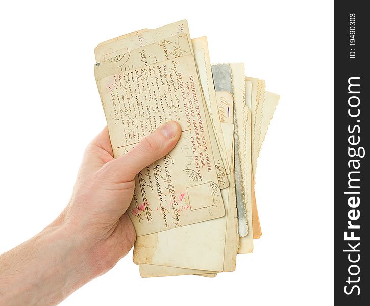 Hand with old handwriting postcard isolated on white