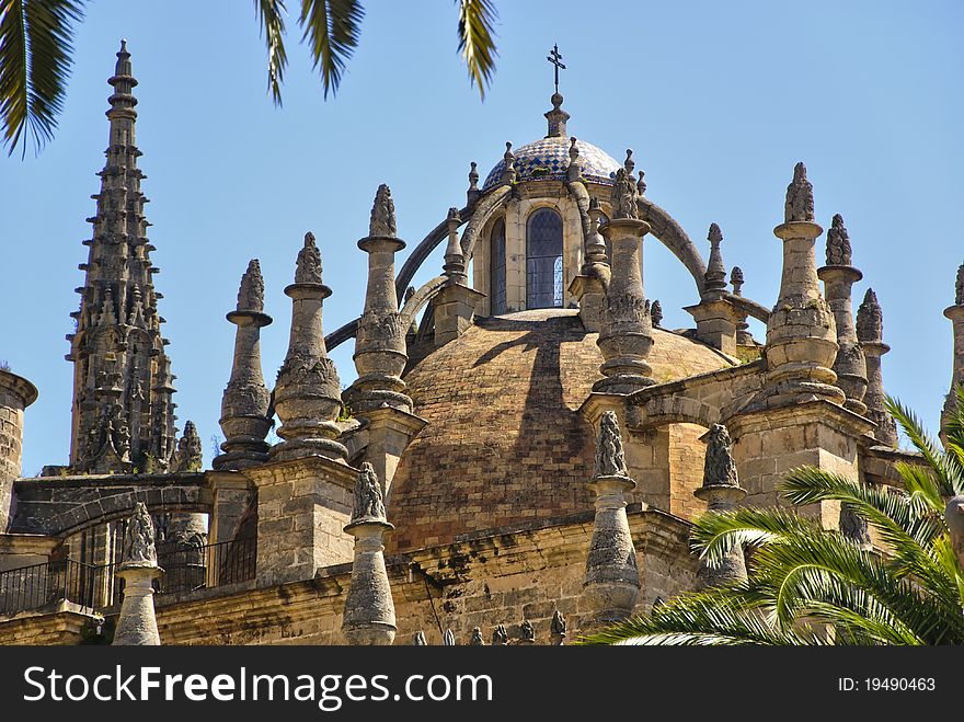 View of details dome, roof and spires of the Cathedral in Seville, Spain