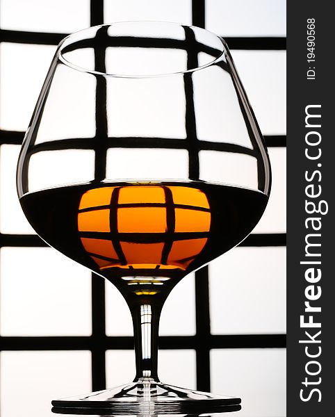Cognac, whisky, rum, wine glass on old background. Cognac, whisky, rum, wine glass on old background