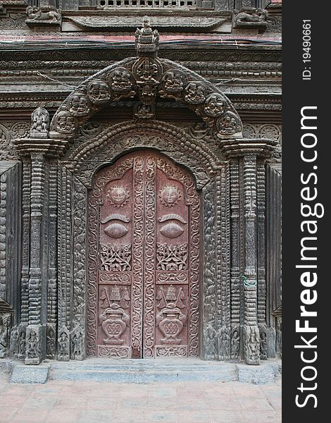 A typical fine carved door of the royal palace of patan in nepal. A typical fine carved door of the royal palace of patan in nepal