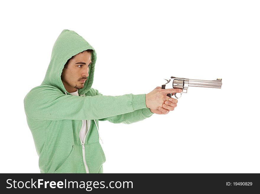 A man in green with a serious expression on his face pointing a gun. A man in green with a serious expression on his face pointing a gun.