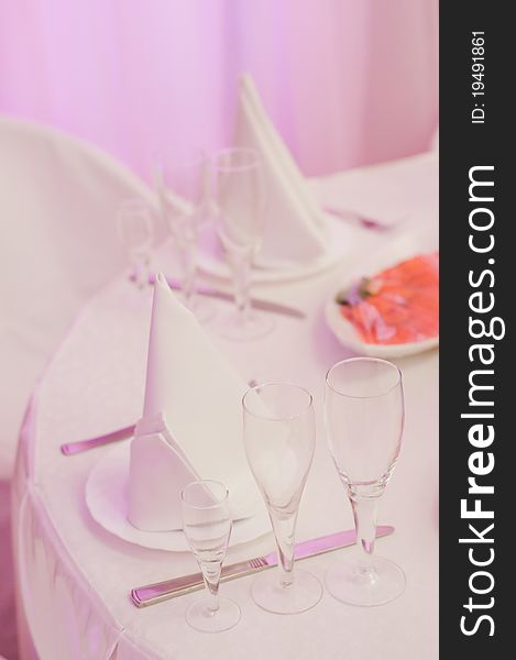 Closeup of banquet table in pink colors