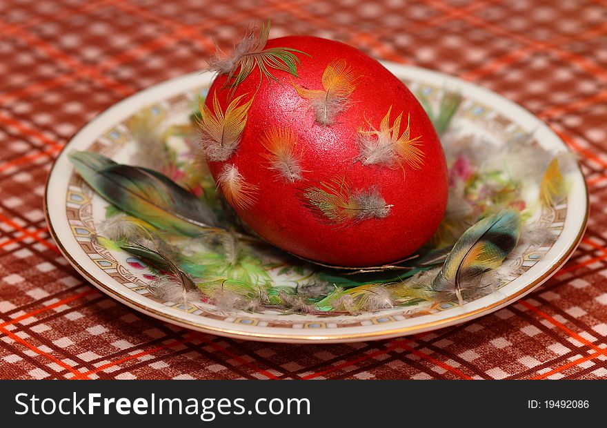 Dyed Easter egg for Easter is on a saucer