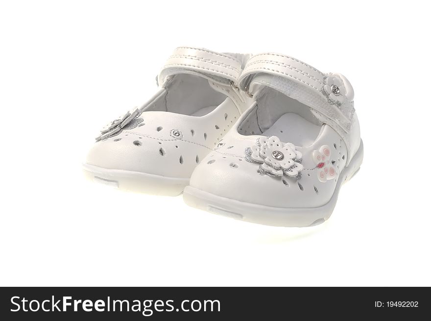 White summer shoes for the girl on a white background. White summer shoes for the girl on a white background