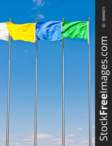 Four flying flag under blue sky