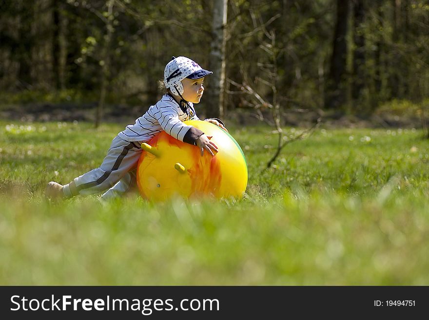 Little boy playing with the ball on the meadow. Little boy playing with the ball on the meadow