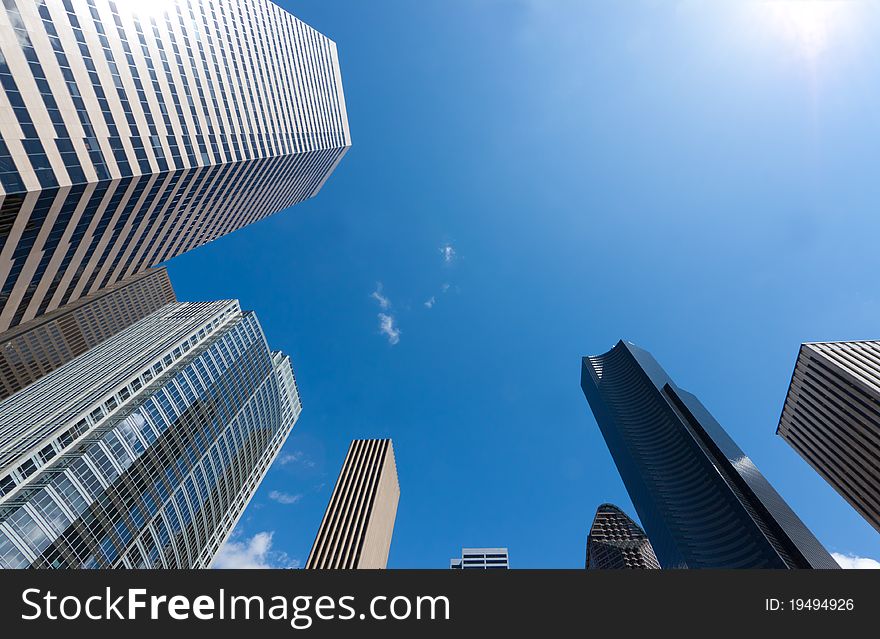 Looking up at a group of modern office buildings