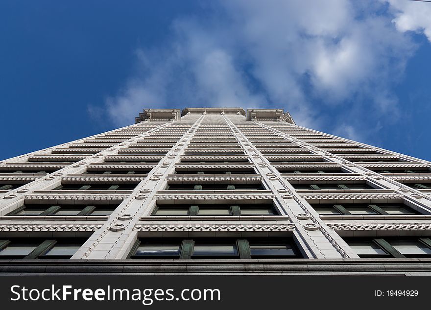 Looking up the facade of a terracotta office building