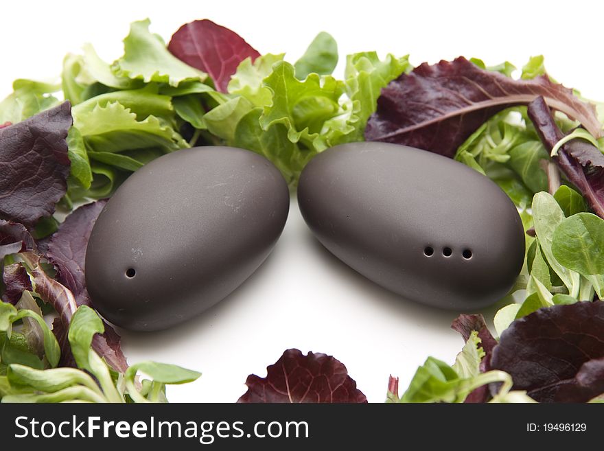 Salt shakers and pepper shakers with lettuce leaves
