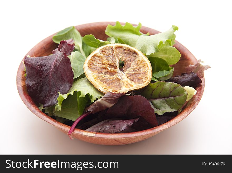 Lettuce leaves with lemon in the bowl