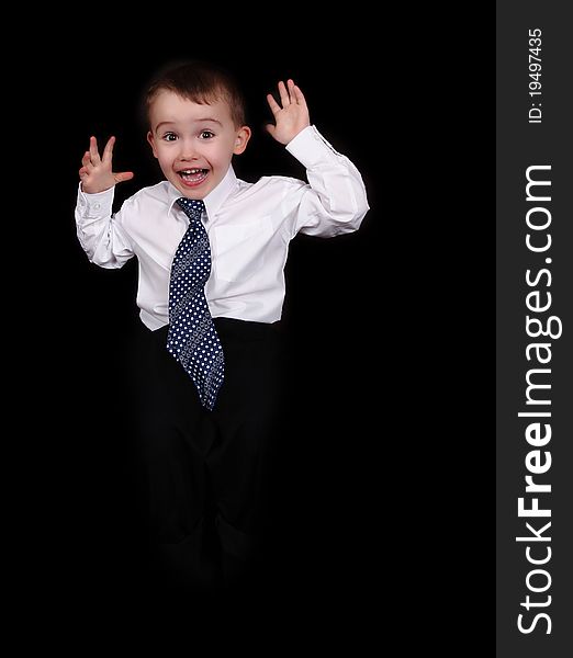 Expressive little boy making funny face. isolated